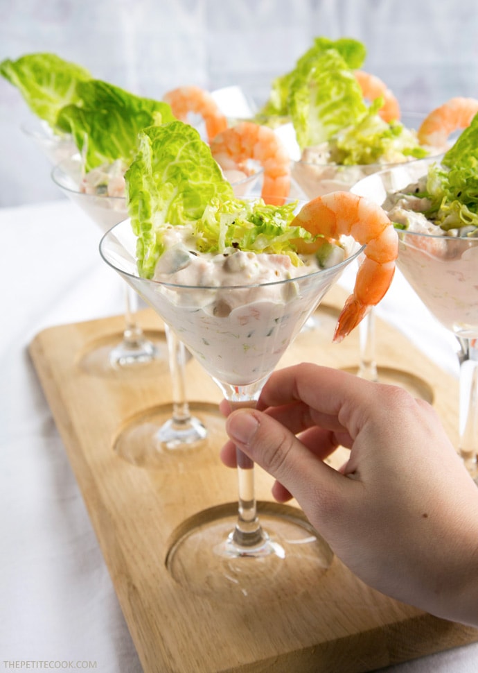 A healthy take on a British classic, this quick gluten-free no-mayo Salmon and Prawn Cocktail is the perfect starter for all the seafood lovers out there! Recipe from The Petite Cook - www.thepetitecook.com