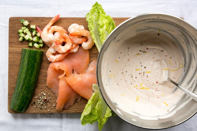 A healthy take on a British classic, this quick gluten-free no-mayo Salmon and Prawn Cocktail is the perfect starter for all the seafood lovers out there! Recipe from The Petite Cook - www.thepetitecook.com