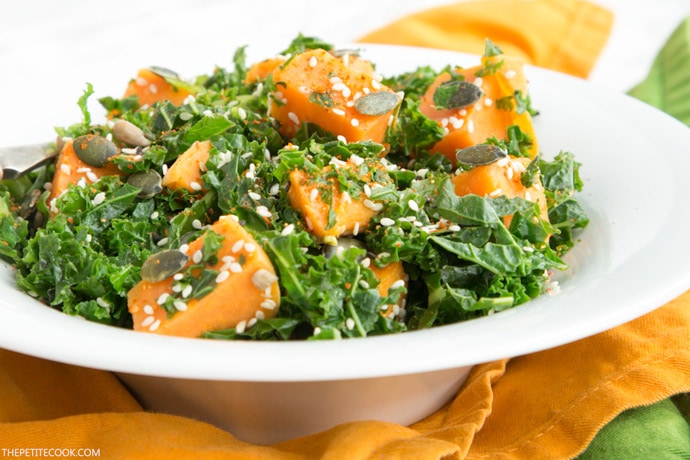 sweet potato and kale salad on a white plate