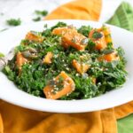 Healthy and fulfilling, this Spicy Sweet Potato and Kale Salad is packed with nutrients, dairy-free, gluten-free and vegan - The perfect warm salad to enjoy on a chilled day. Recipe from The Petite Cook - www.thepetitecook.com