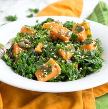 Healthy and fulfilling, this Spicy Sweet Potato and Kale Salad is packed with nutrients, dairy-free, gluten-free and vegan - The perfect warm salad to enjoy on a chilled day. Recipe from The Petite Cook - www.thepetitecook.com