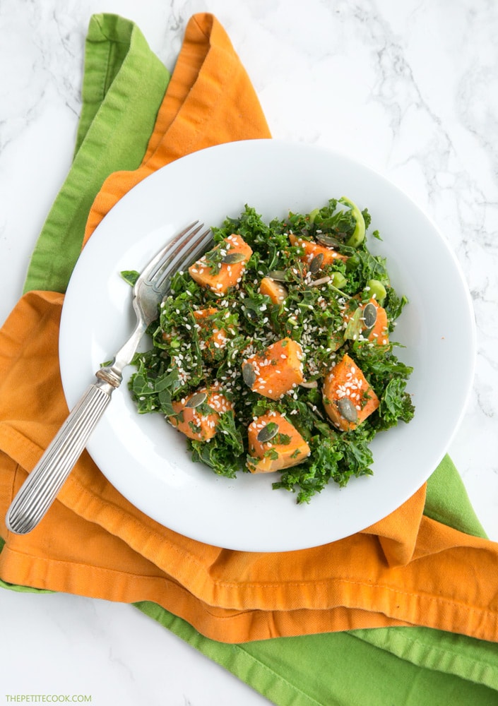 sweet potato and kale salad on a white plate