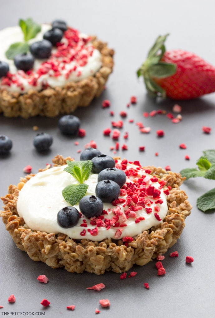 Mascarpone granola tarts topped with blueberries, freeze-fried strawberry and mint leaves.