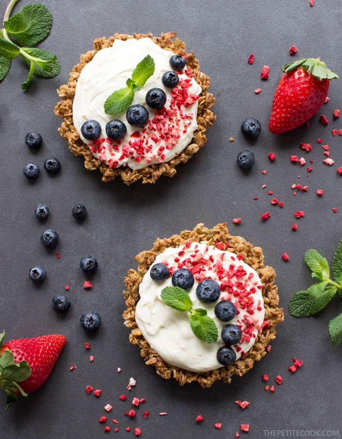 Mascarpone granola tarts topped with blueberries, freeze-fried strawberry and mint leaves.