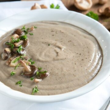 You'll never go back to the canned stuff once you try this super easy Homemade Cream of Mushroom Soup - Ready in just 20 min, vegetarian and with tons of flavor, it's the best soup EVER! Recipe by The Petite Cook - www.thepetitecook.com