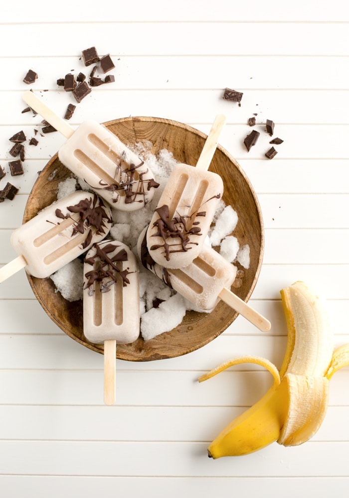 Healthy vegan Banana Chocolate Popsicles made with just 3 simple ingredients. Naturally dairy-free and gluten-free, they make the perfect summer treat to share! Recipe by The Petite Cook