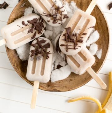Healthy vegan Banana Chocolate Popsicles made with just 3 simple ingredients. Naturally dairy-free and gluten-free, they make the perfect summer treat to share! Recipe by The Petite Cook