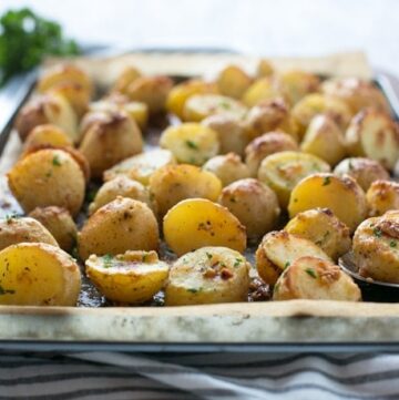 Truffle Pesto Roasted Potatoes make a fantastic side to serve on special occasions such as Thanksgiving, Christmas and New Year's Eve. They're also simple and quick enough to whip up for a weeknight dinner! Recipe by The Petite Cook