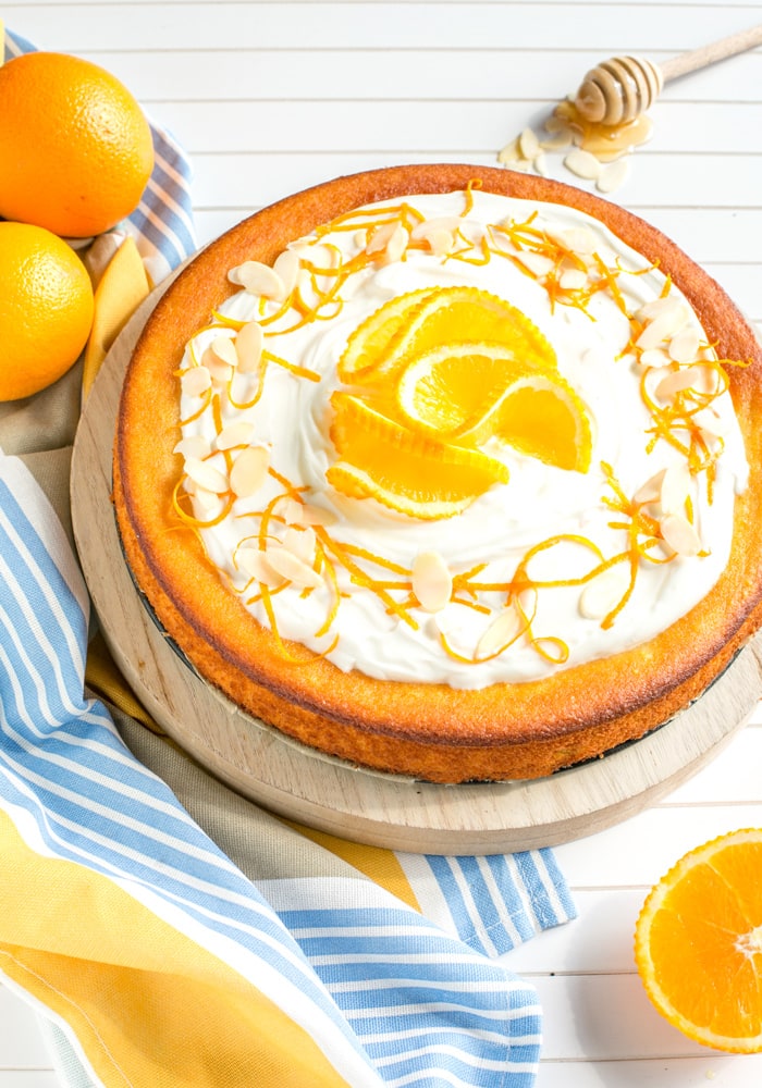 This Flourless Orange Cake is incredibly light and moist - It's also gluten-free and dairy-free, making it the perfect allergy-friendly dessert! Recipe by The Petite Cook