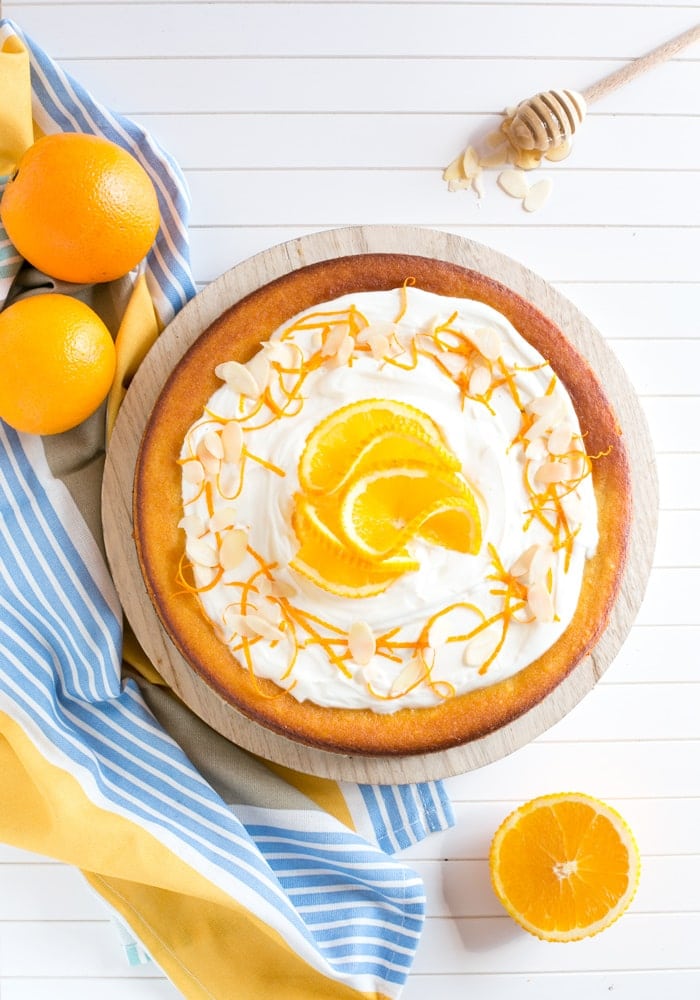 This Flourless Orange Cake is incredibly light and moist - It's also gluten-free and dairy-free, making it the perfect allergy-friendly dessert! Recipe by The Petite Cook