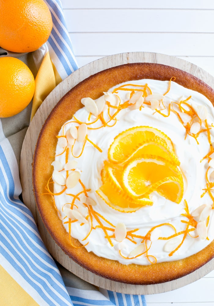 This Flourless Orange Cake is incredibly light and moist - It's also gluten-free and dairy-free, making it the perfect allergy-friendly dessert! Recipe by The Petite Cook