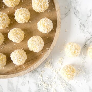 Easy Indian Pineapple Ladoo on a marble worktop and on a wood plate