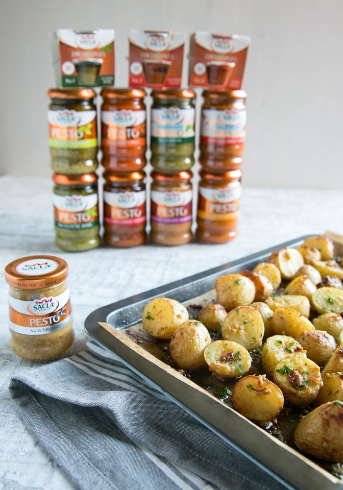 Truffle Pesto Roasted Potatoes next to Sacla pesto jars