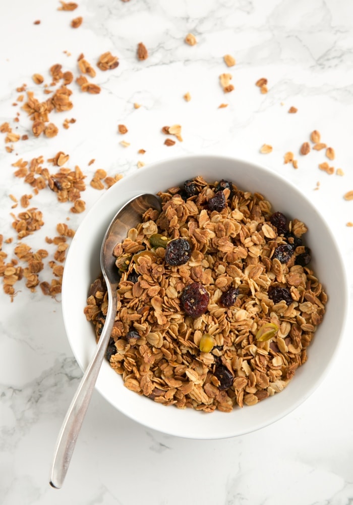 a bowl of homemade granola with a spoon