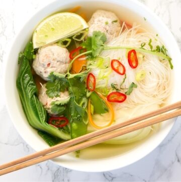 Thai Turkey Meatball Soup in a bowl with chopsticks on the side