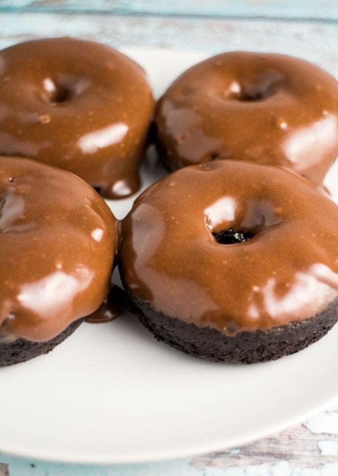 vegan chocolate donuts with chocolate frosting.