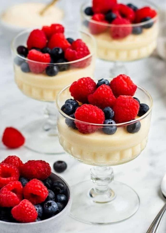 Vegan vanilla pudding topped with fresh berries.