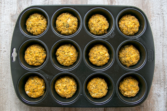 veggie sweet potato fritters in a muffin tin