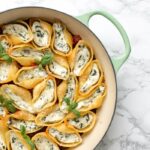 These classic Italian Spinach and Ricotta Stuffed Pasta Shells have all it takes to become a family favourite. Awesomely vegetarian, they're easy and quick enough to make for a weeknight dinner, but also pretty enough to serve at dinner parties and get-togethers. Recipe by The Petite Cook