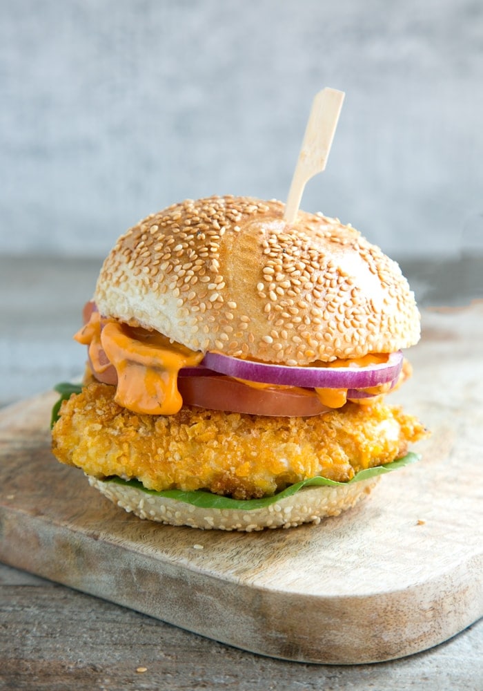 Buttermilk Oven Fried Chicken Burger served on a wood board