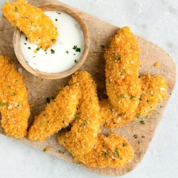 oven fried chicken tenders with yogurt dip on the side