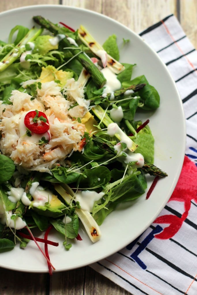 crab, avocado and greens salad in a bowl