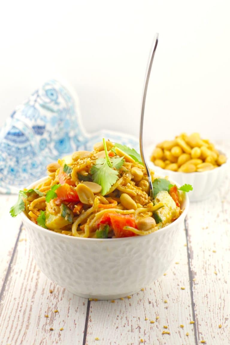 vegan peanut noodles salad in a bowl with chopsticks