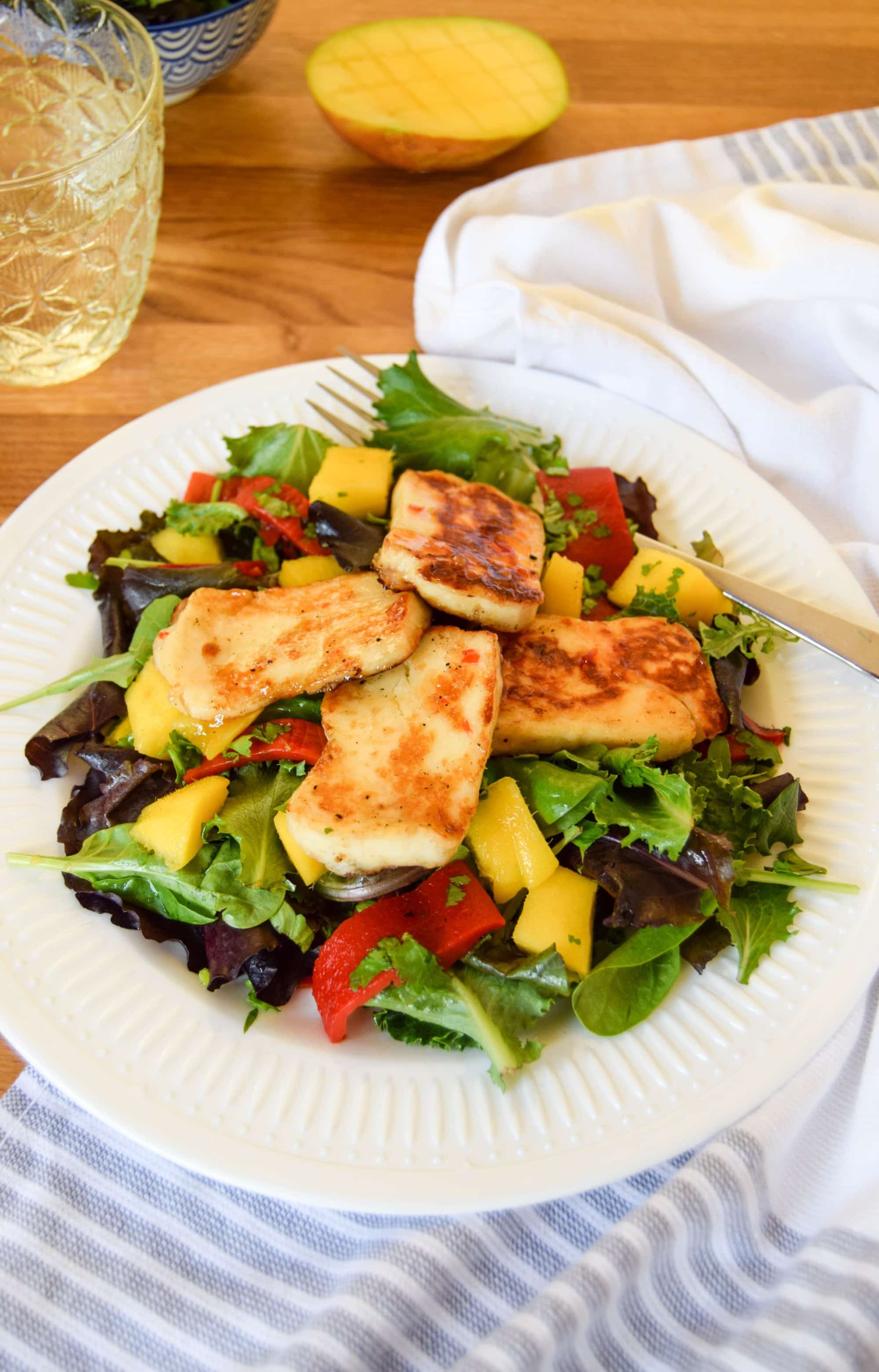 sweet chili halloumi and mango salad on a plate