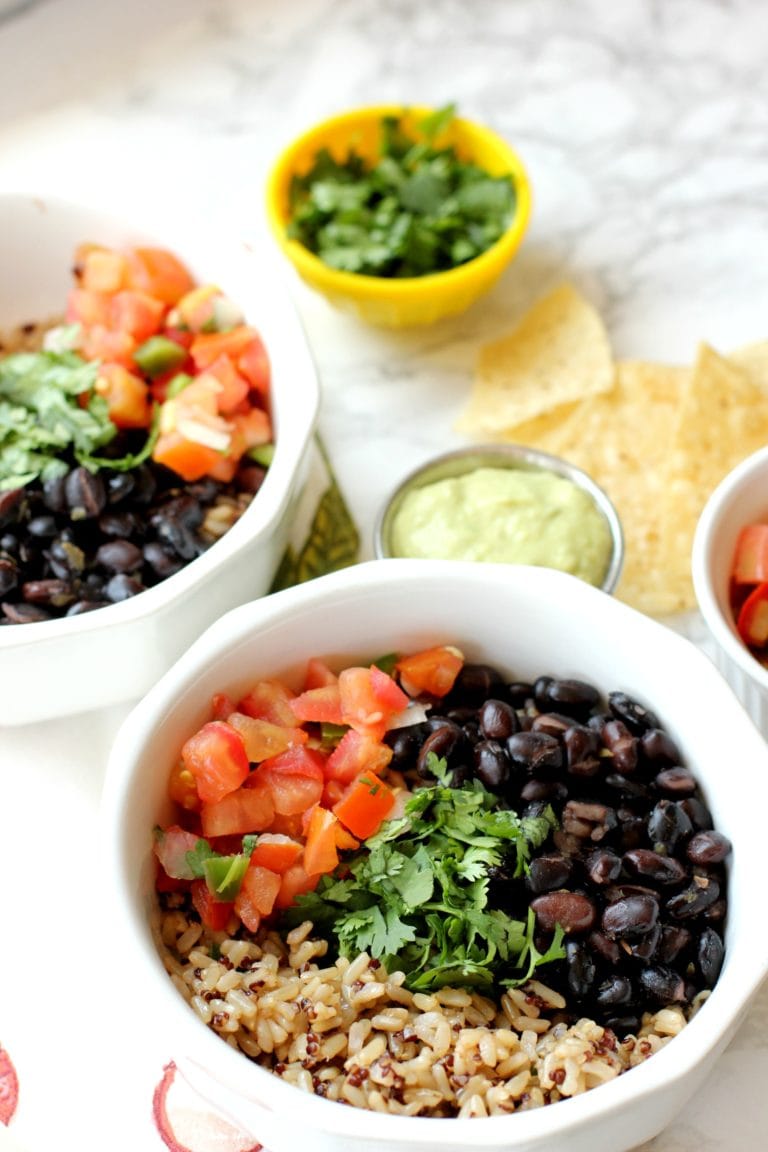 vegan burrito bowl with rice, tomatoes, beans