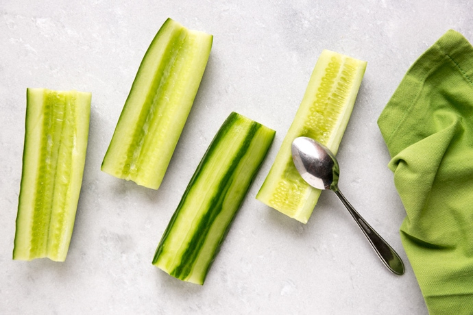 cucumber boats with a spoon and green napkin