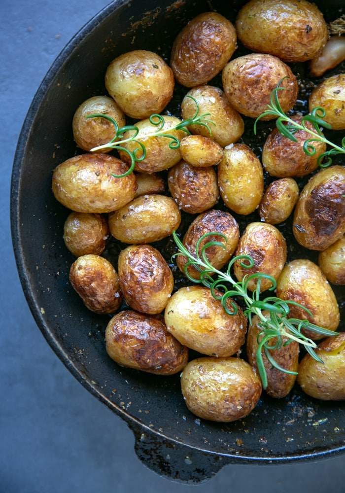 Italian pan roasted new potatoes with rosemary in skillet