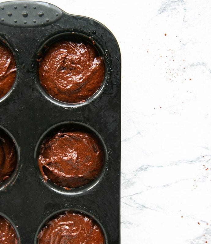 recipe step 2: batter divided among a muffin tin.