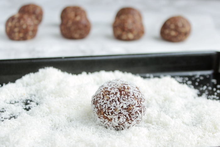 recipe step 4: chocolate balls rolled into coconut flakes.