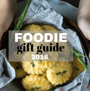 hands holding parmesan cookie with the text foodie gift guide 2018 overlayed