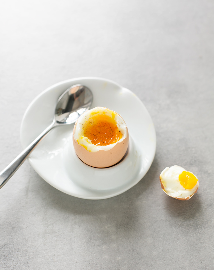 soft-boiled egg on an egg holder plate.