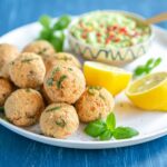 Baked salmon meatballs with avocado dip.