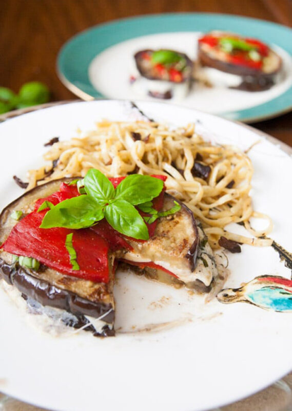 grilled eggplant stack stuffed with mozzarella and topped with bell pepper.