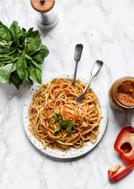 hidden vegetable sauce with spaghetti on a plate with serving forks.