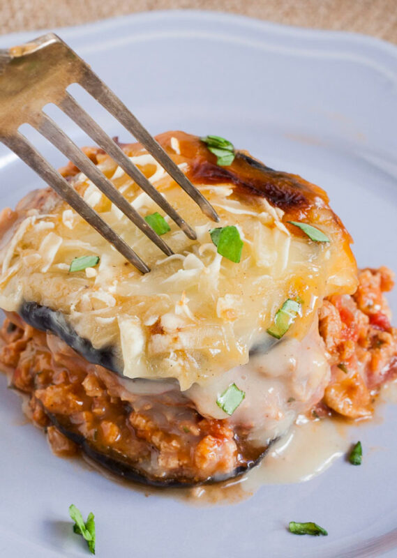 fork over vegan moussaka on a plate.