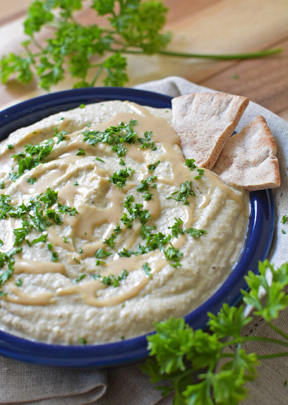 roasted baba ganoush in a plate served with pita bread