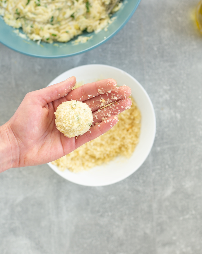 recipe step 2: using your hand roll each ball into the coating mix 