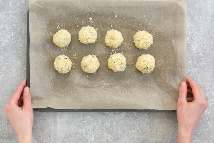 recipe step 3: arrange the fish croquettes on a baking tray covered with parchment paper and bake in the oven