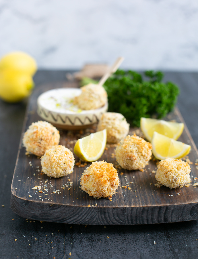 baked fish croquettes served with garlicky yogurt dip and lemon wedges