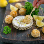 baked fish croquettes served with garlicky yogurt dip and lemon wedges