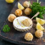 baked fish croquettes served with garlicky yogurt dip and lemon wedges