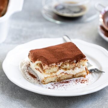 classic tiramisu without eggs served on a plate