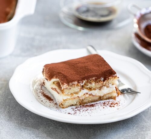 classic tiramisu without eggs served on a plate
