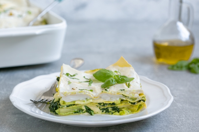 vegetarian lasagna with ricotta white sauce served on a plate