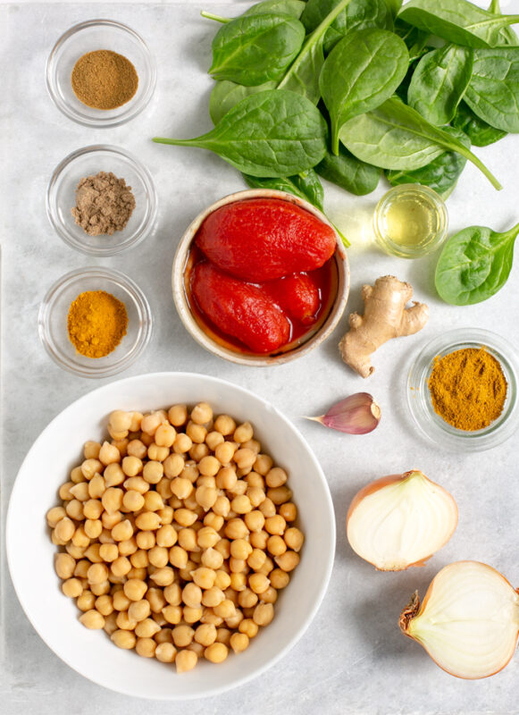 recipe ingredients: chickpeas, tomatoes, spinach, spices, onion, garlic, ginger, vegetable oil