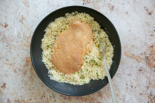 chicken slice dipped into breadcrumbs.